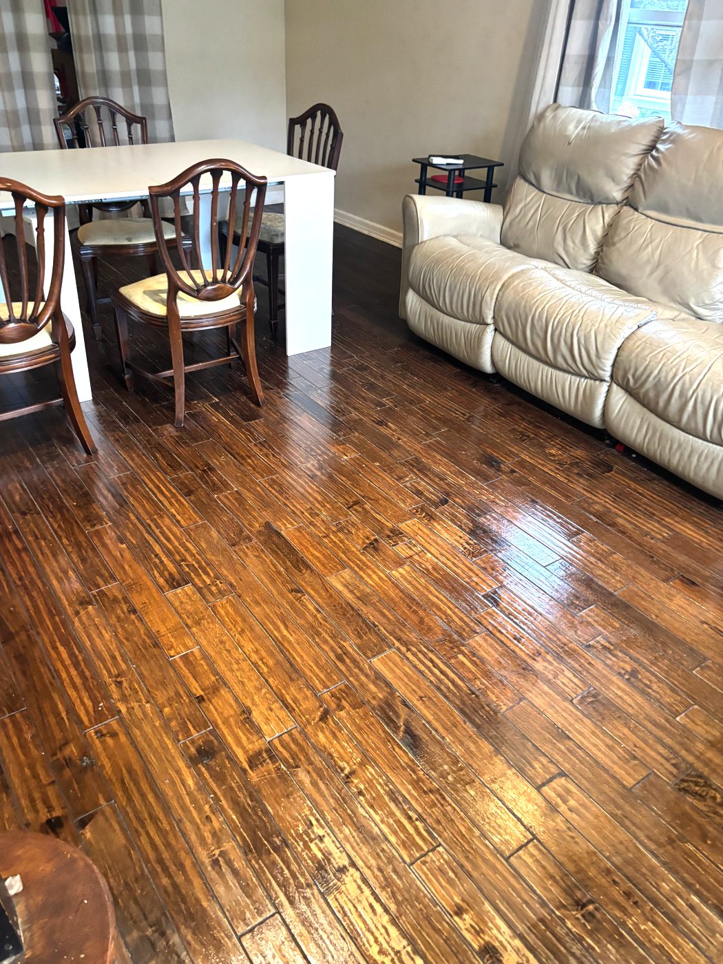 Freshly cleaned living room with shining hardwood floors